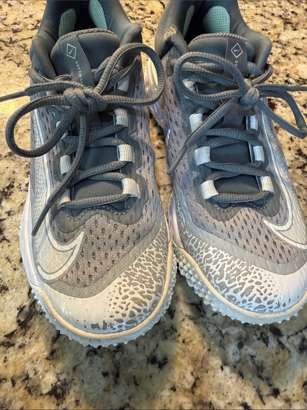 Nike women’s softball Gray cleats with Subtle Light Accents
